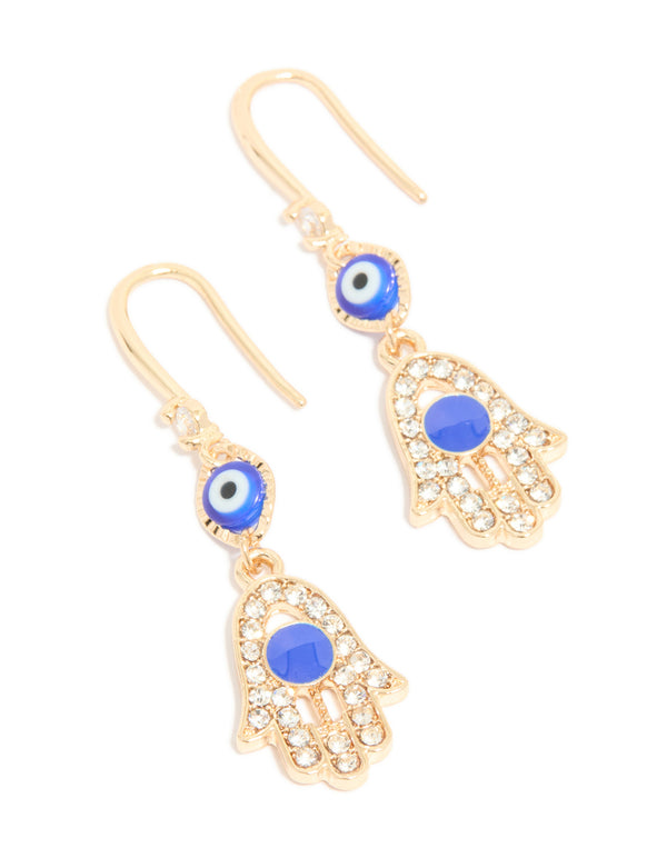These gold cubic zirconia evil eye and hamsa hand drop earrings feature charm, white, black, and royal blue elements in front view