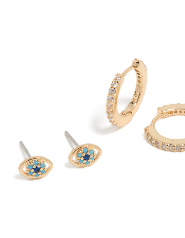 Featuring evil eye & cross cubic zirconia stud and huggie earrings in gold 3-pack close up view