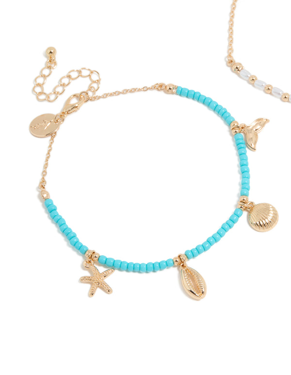 Beautifully crafted turquoise and white beaded anklets with ocean-inspired shell charms featuring pearl accents in gold, 2-pack bracelets detail view