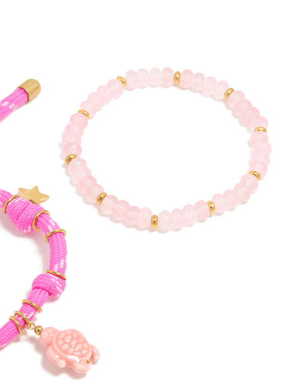 Crafted from waterproof gold plated stainless steel semi precious stone and sea cord bracelets in a 2-pack with beads, heart and ocean charm, rose quartz accents closure detail view