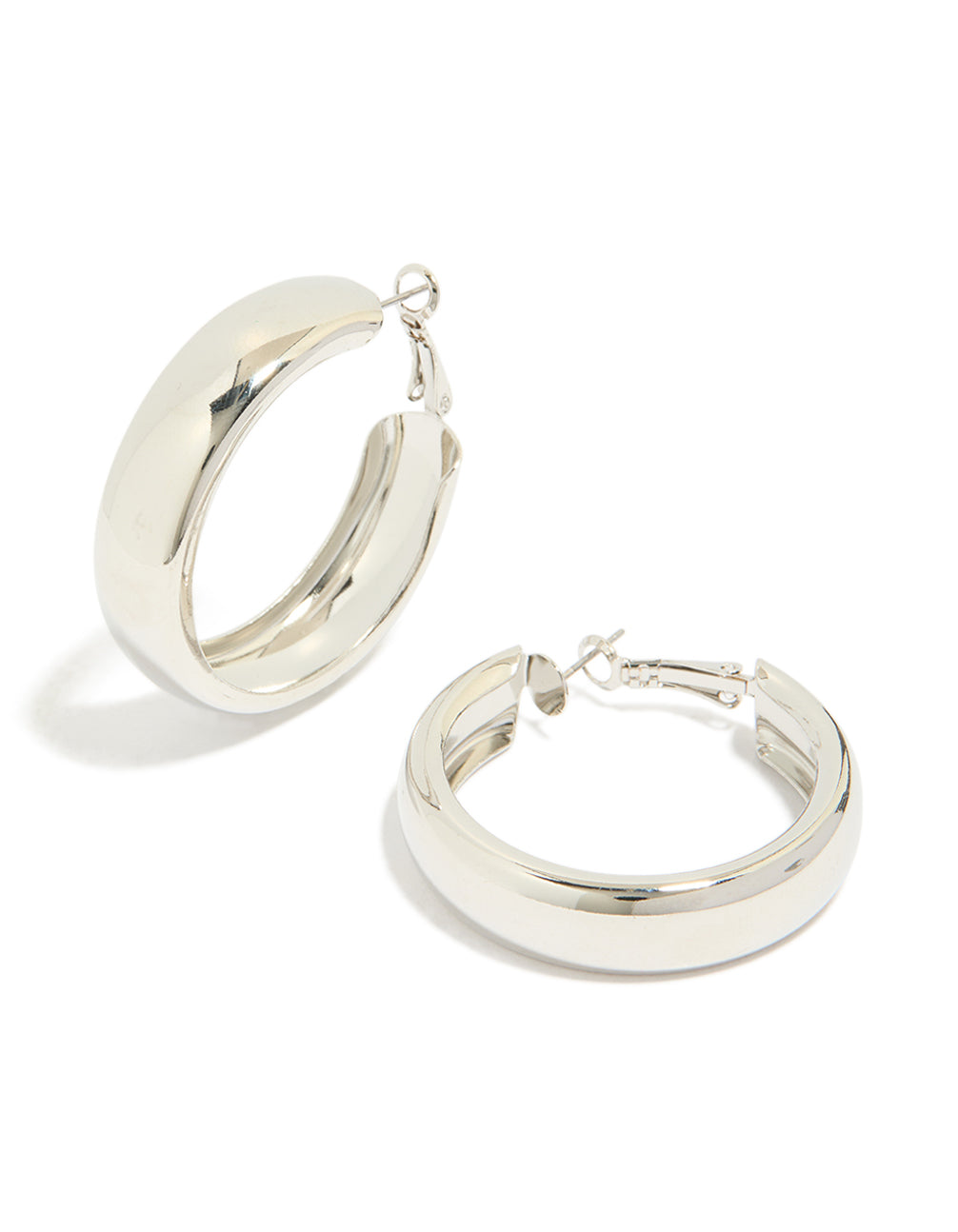 Showcasing chubby flat hoop earrings in silver with chunky styling and closure front view