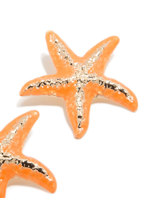 Designed with orange coated metal starfish statement stud earrings featuring ocean inspired gold accents post detail view