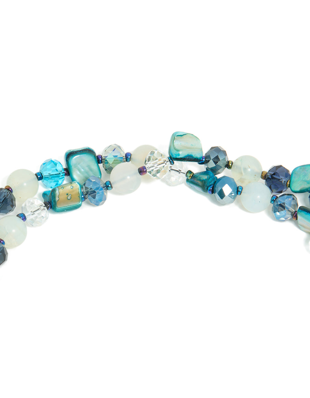 Showcasing an irregular double layered statement necklace with beads, ocean-inspired detailing in turquoise, navy, pale turquoise, and teal close up view