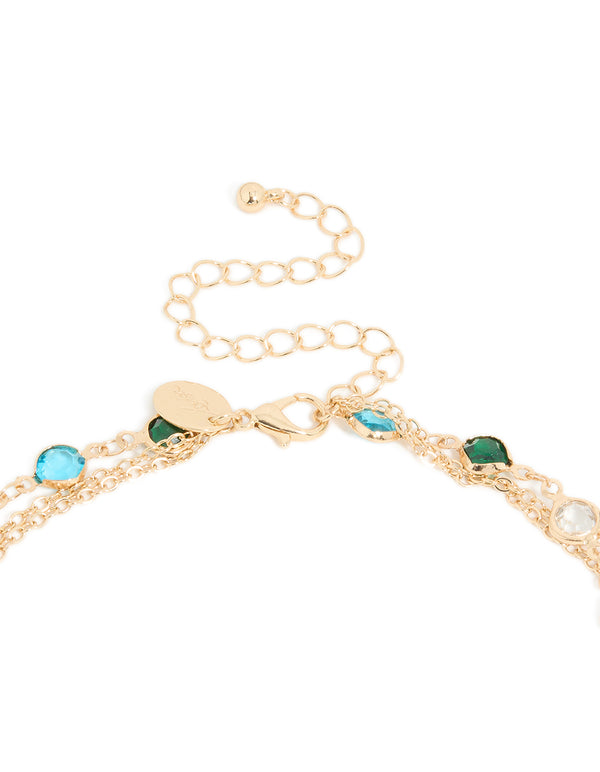 Discover this gold layered Y-necklace with charm, beads, coin, and cross featuring crystal glass stones in statement style clasp detail view