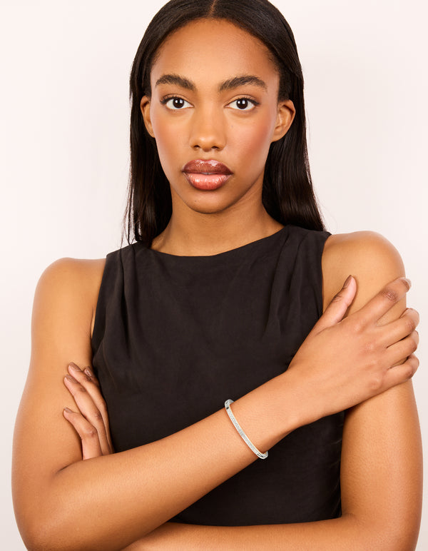 Styled silver plated bezel diamante tennis bracelet in white on model view