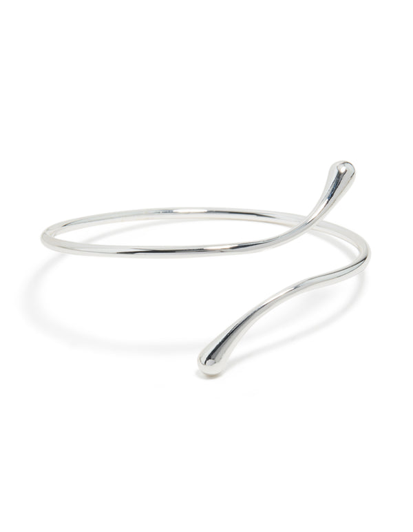 Showcasing a molten drop arm cuff crafted from silver plated metal with statement styling front view