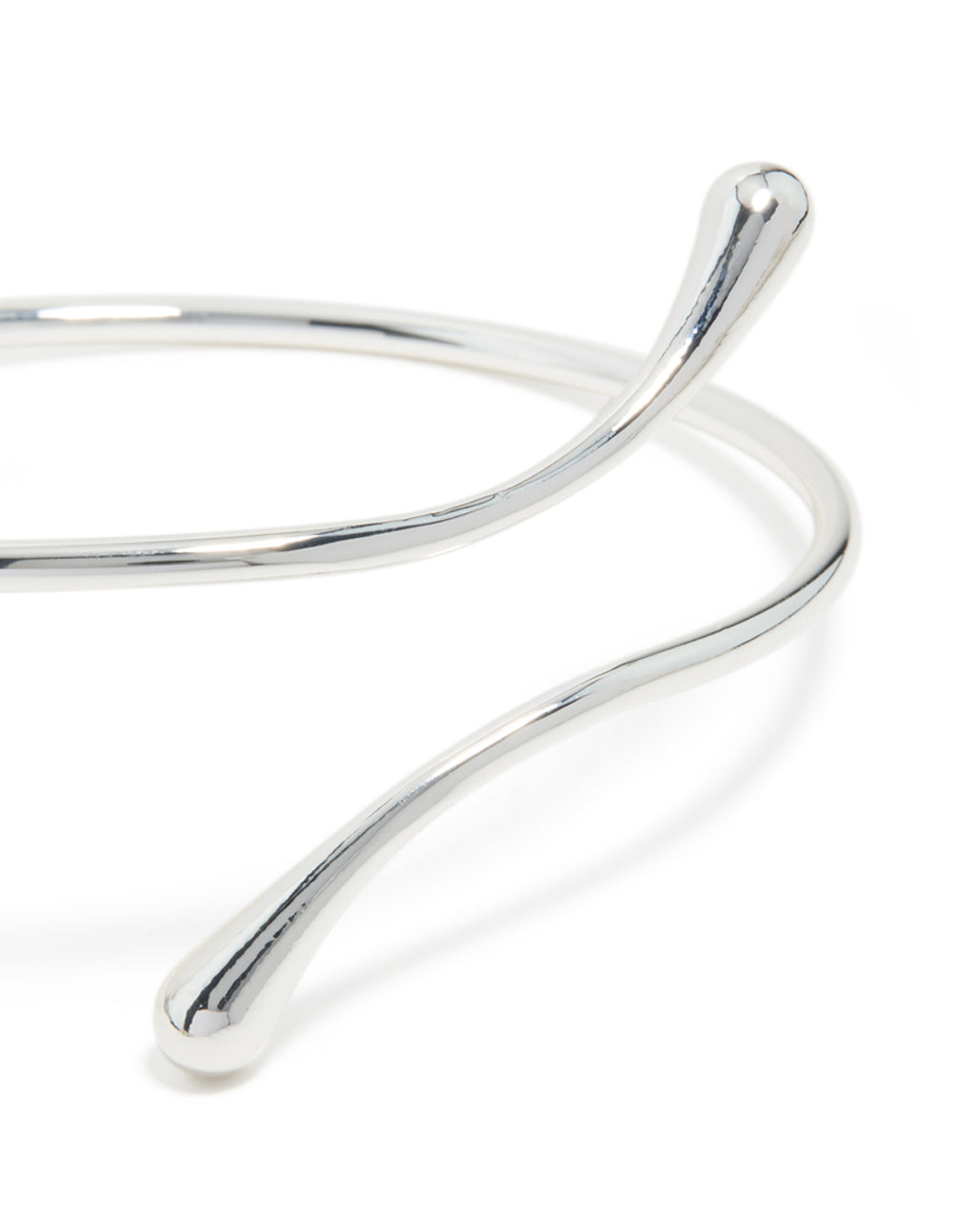 Featuring a molten drop arm cuff in silver plated metal with statement design close up view