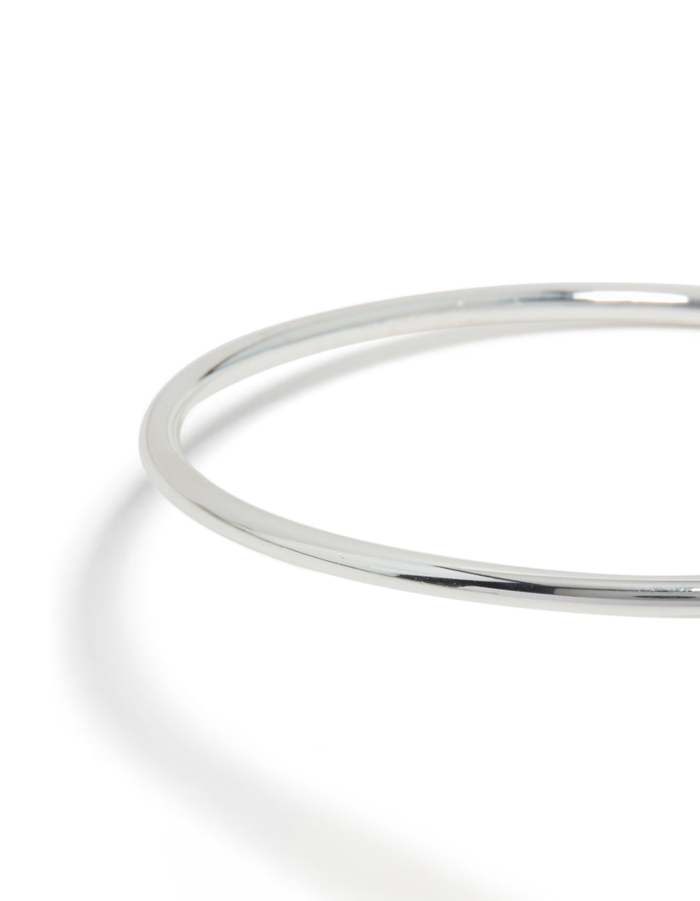 Featuring a molten drop arm cuff in silver plated metal with statement design close up view