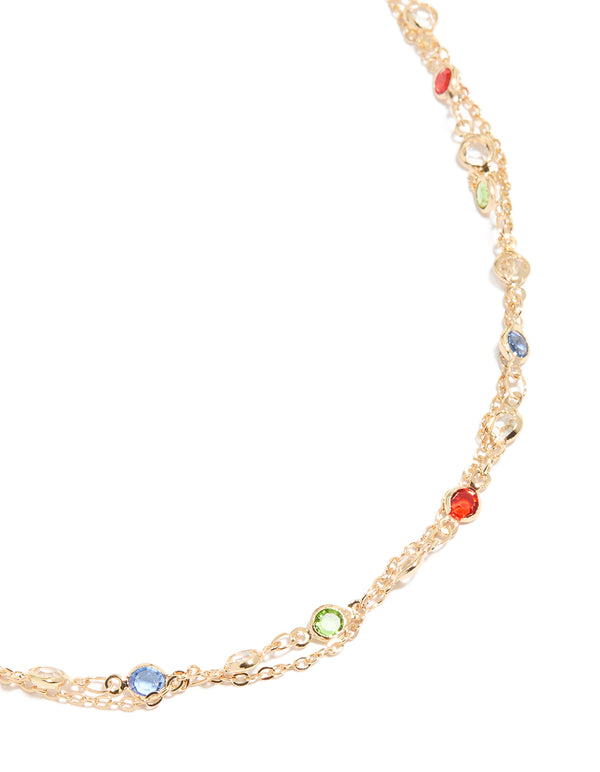 Discover a gold embellished waisted belt with red lime green and skyblue stones detail view