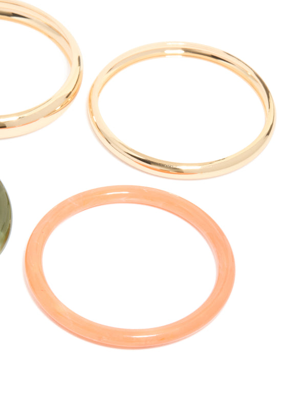 Featuring gold and mixed acrylic bangles in a 4-pack with close up view