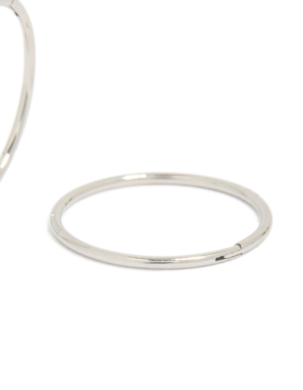 Detailing surgical steel sleeper earrings in silver with hoop closure post detail view