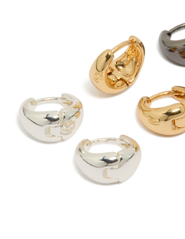 Featuring mixed metal small graduated huggie earrings in a 3-pack with gold and silver plated finishes close up view