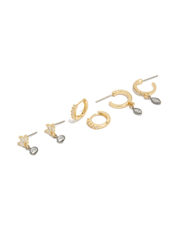 Explore mixed metal plated cubic zirconia bezel stud and huggie earrings in a 3-pack with gold, silver, and clear tones front view