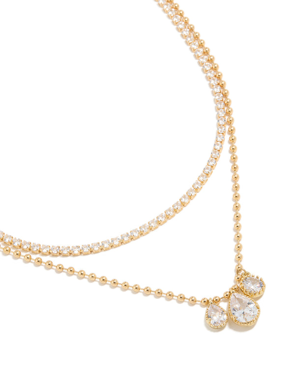Beautifully crafted gold plated cubic zirconia tennis and droplets layered necklace with balls close up view