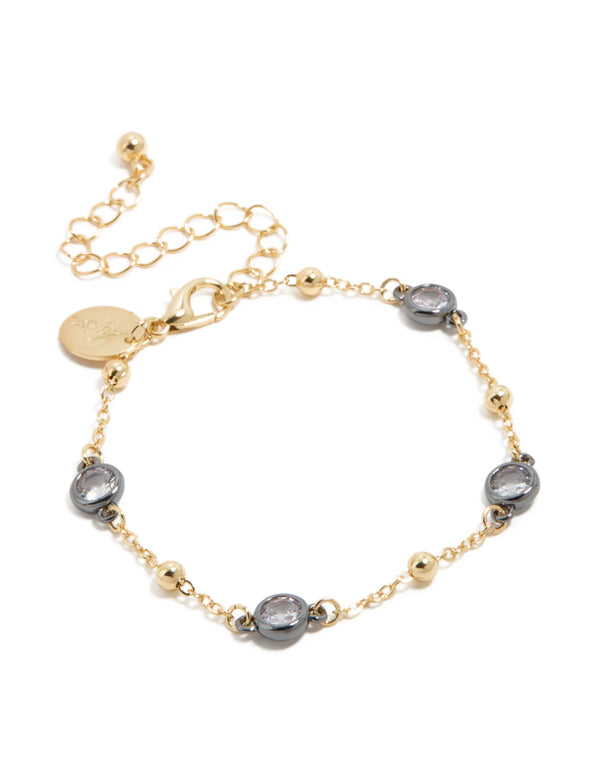 Showcasing a mixed metal ball chain bracelet featuring cubic zirconia stone accents detail in gold front view