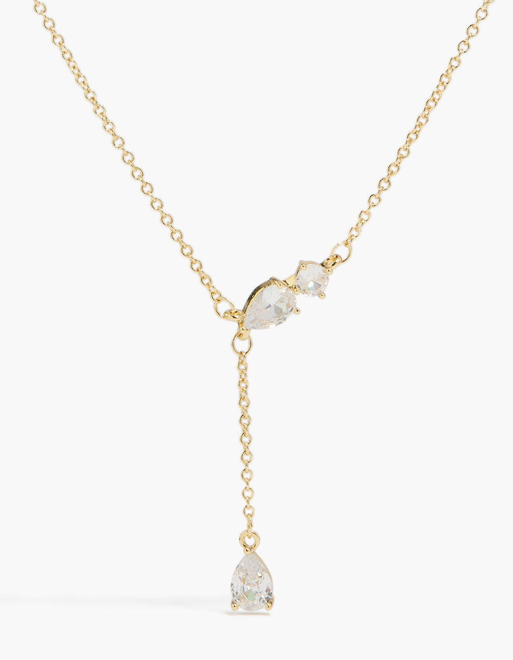 Showcasing a gold plated cubic zirconia trio Y-necklace close up view