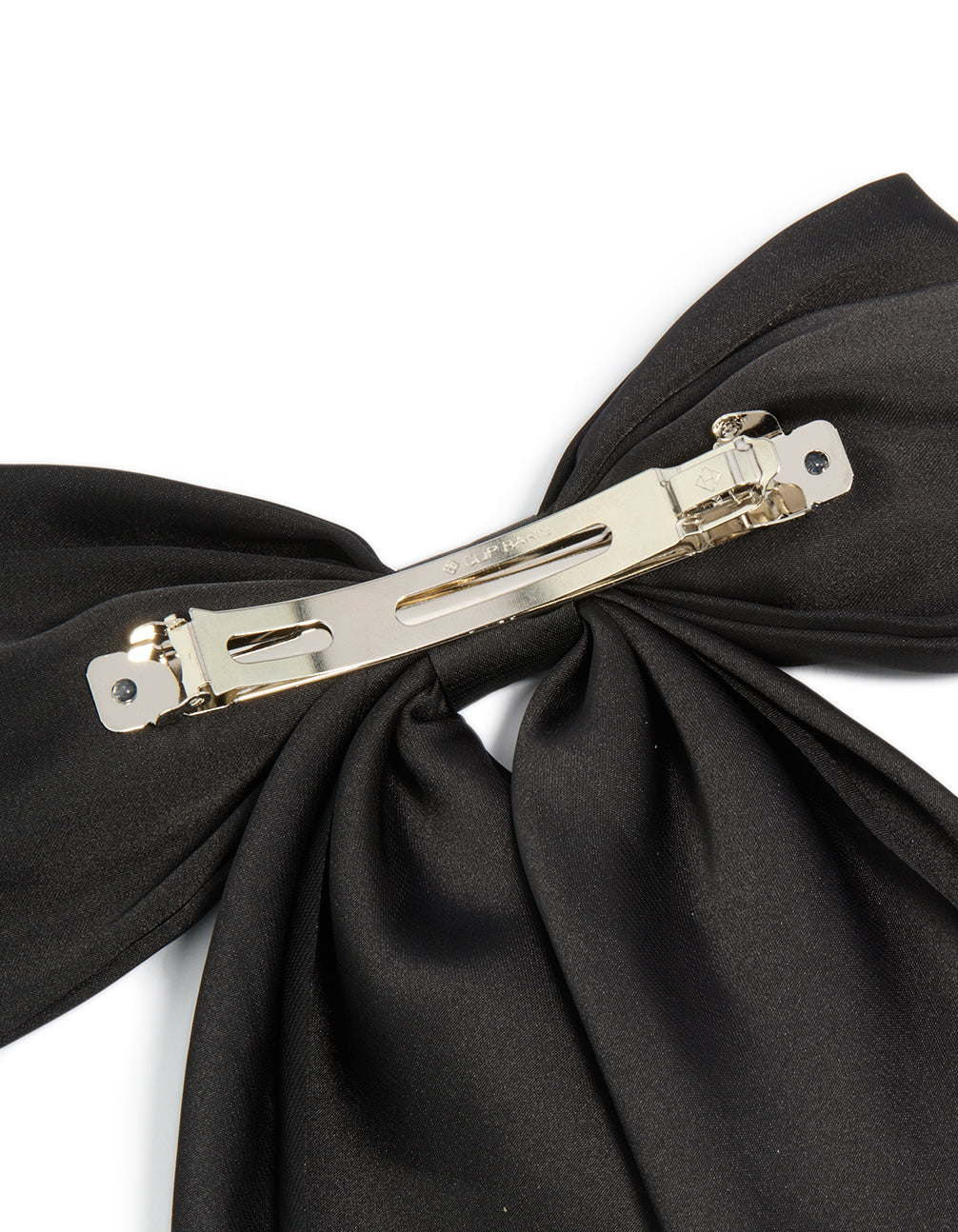Designed with a bow in solid black and silver closure this hair clip detail view