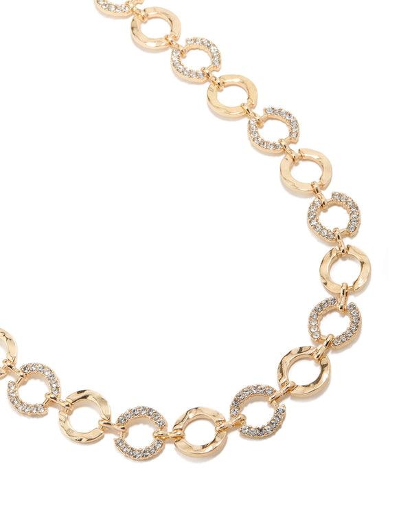 Showcasing a gold mini diamante and molten circle belt with embellished waisted statement design detail view