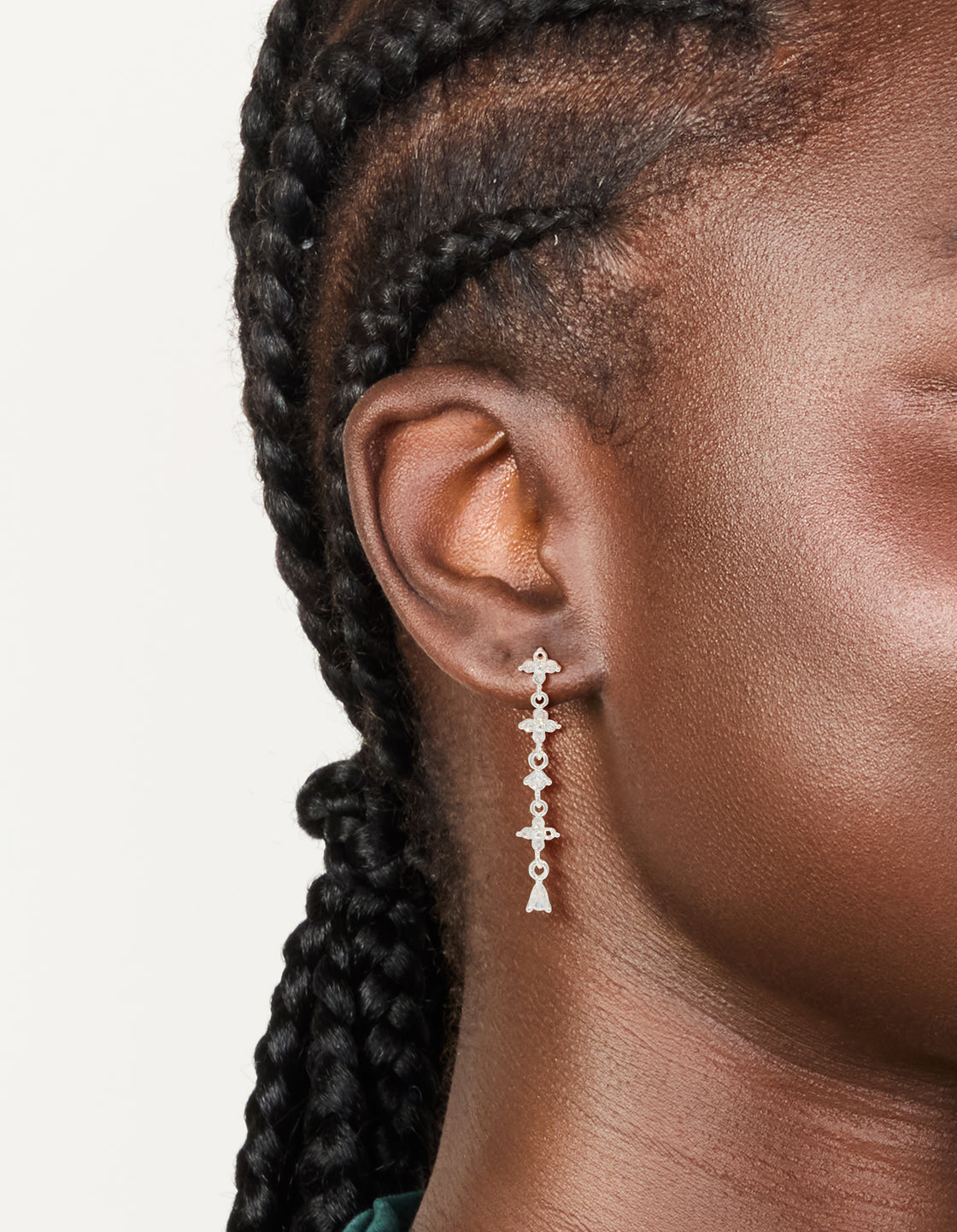 Stunning floral cubic zirconia drop earrings in silver plated finish with statement style on ear view