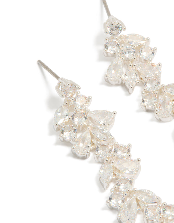 Elegant dainty drop earrings, crafted from silver plated material featuring cubic zirconia in clear close up view