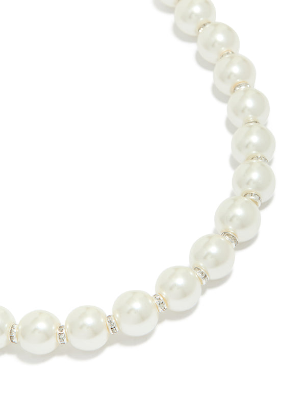 Showcasing a pearl and diamante necklace crafted from silver plated beads close up view