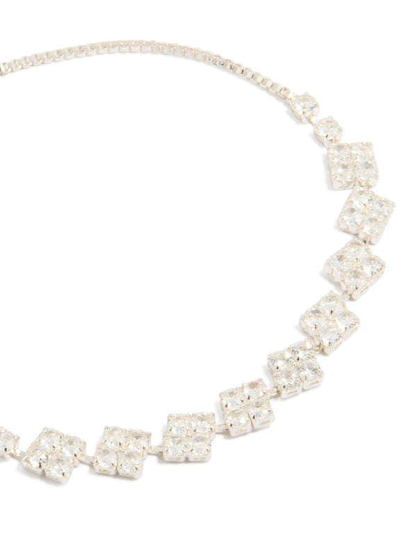 Showcasing a cubic zirconia flower detail toggle bracelet in silver plated finish close up view