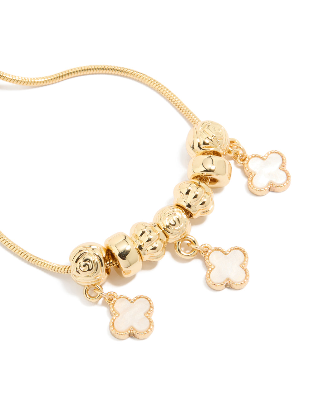 Detailed view of gold plated beaded charm toggle bracelet with pink genuine shell flower inlay close up view