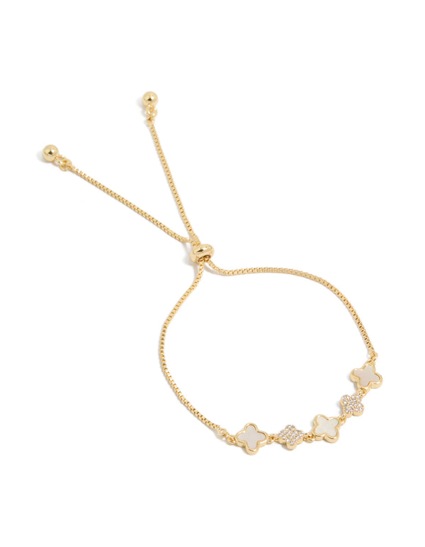 Elegant gold plated toggle bracelet featuring cubic zirconia and floral details in ivory front view