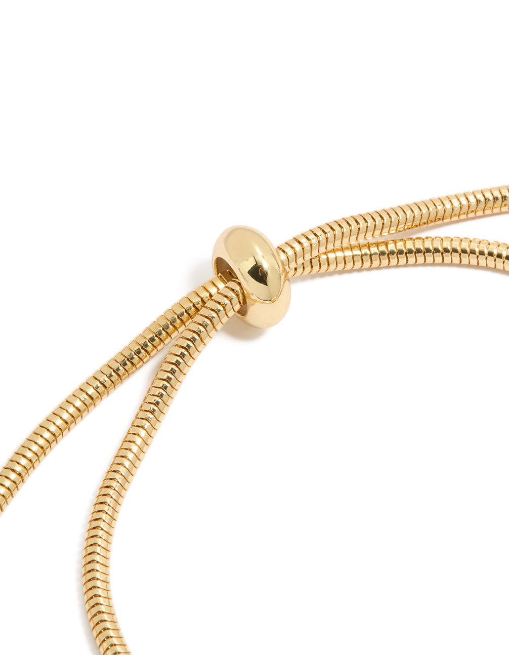 Highlighting a gold plated cubic zirconia chunky heart charm toggle bracelet design closure detail view