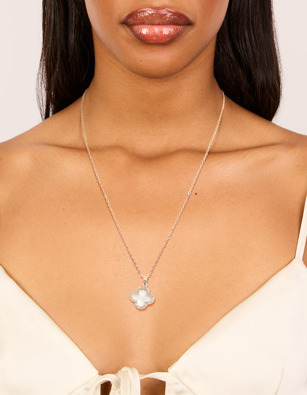 Beautiful floral pendant necklace with diamante and pink outline, crafted from rose gold plated material featuring cubic zirconia on neck view