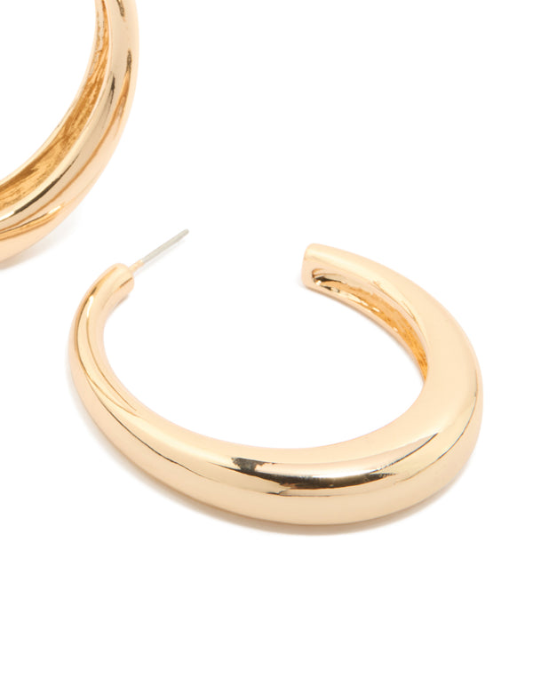 Presenting gold plain wide hoop earrings in a polished finish close up view