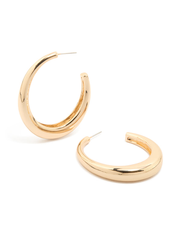 Featuring gold plain wide hoop earrings with a polished finish front view