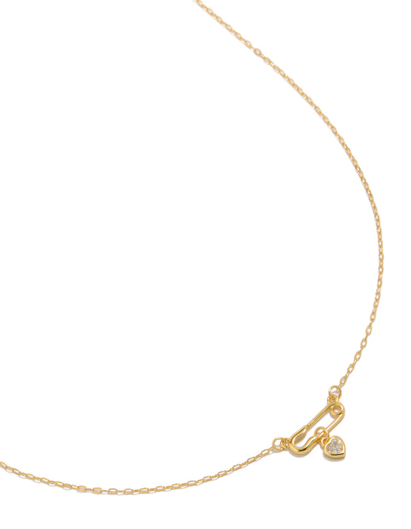 Showcasing a gold plated sterling silver cubic zirconia safety pin necklace with heart close up view