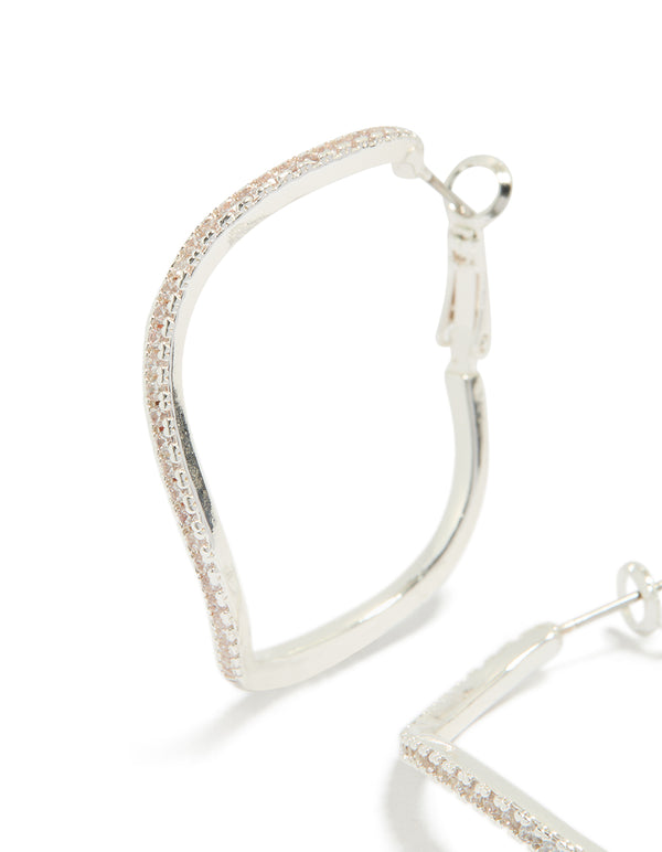 Crafted from silver diamante wavy thin hoop earrings close up view