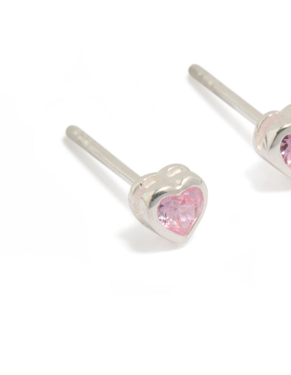 Highlighting sterling silver pink cubic zirconia heart earrings close up view