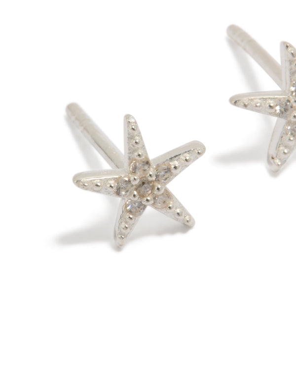 Featuring dainty sterling silver cubic zirconia starfish earrings with ocean-inspired design close up view
