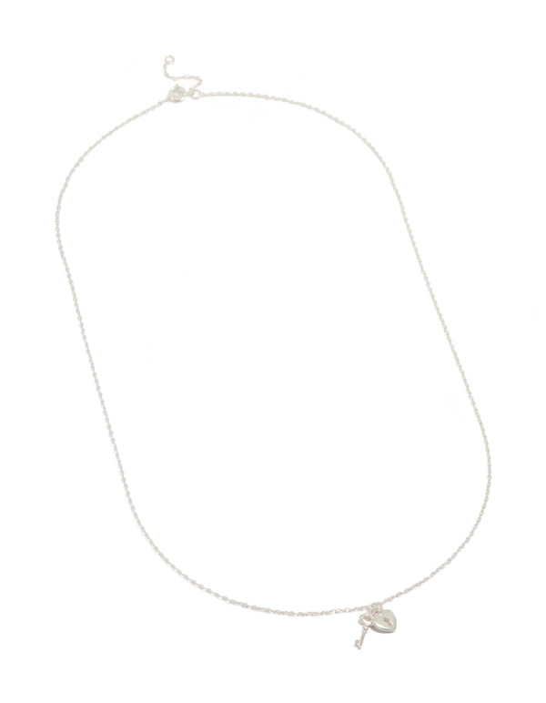 Elegant heart and key pendant necklace with charm accents crafted from sterling silver in a lustrous silver tone front view