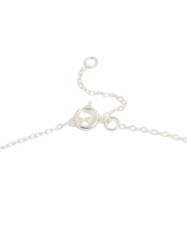 Showcasing a heart and key pendant necklace with charm details in sterling silver featuring toggle closure clasp detail view