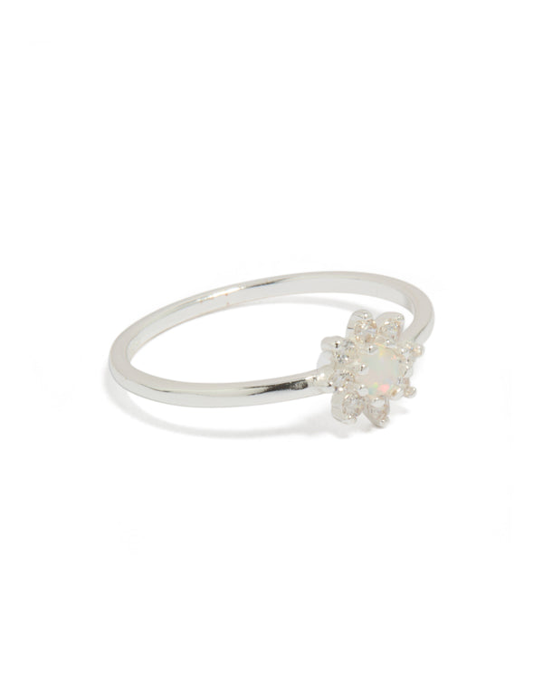 Showcasing a sterling silver cubic zirconia faux opal star ring featuring celestial design in white and ivory side detail view