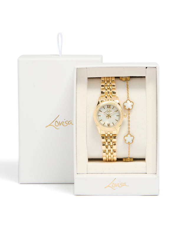 Beautifully boxed gold watch and flower bracelet set with white dial, roman numerals, round shape, formal occasion accessory, link band, and analog mechanism watch face detail view