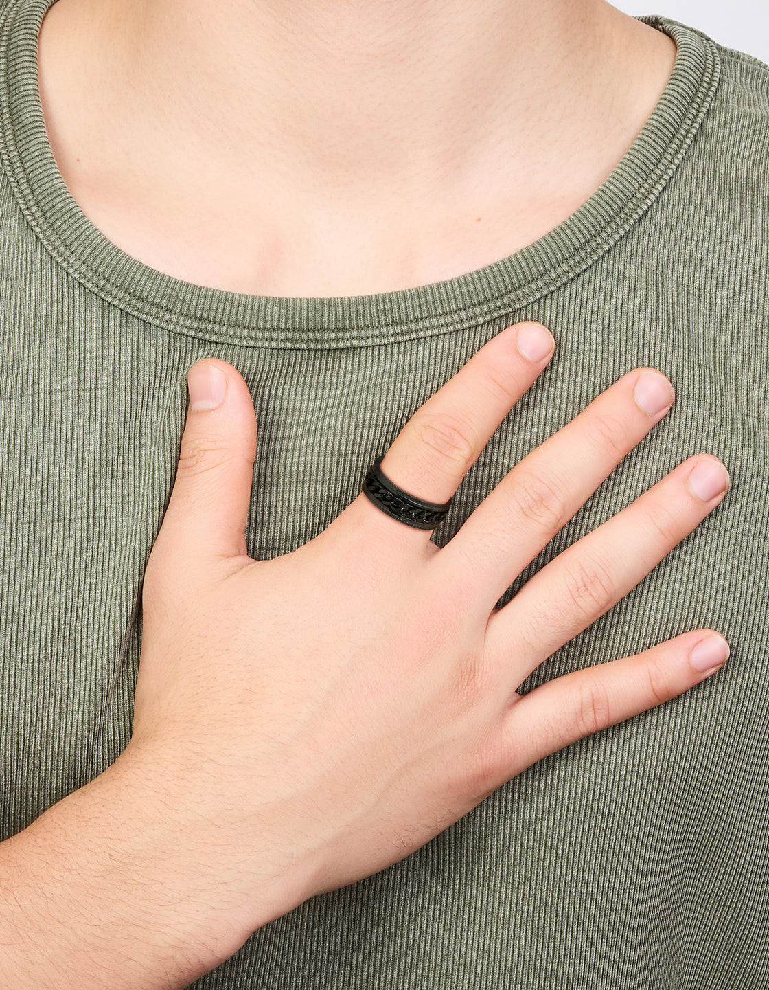 Showcasing a mens waterproof black coated stainless steel chain detail band ring on finger view