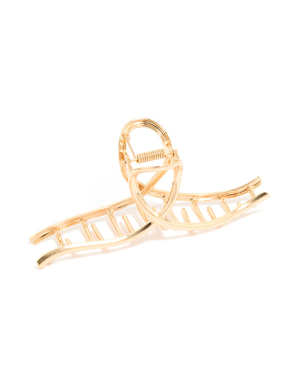 Showcasing a gold wavy claw clip side view