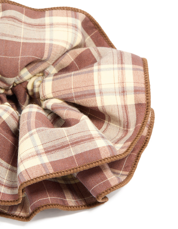 Elegant ruffled checkered fabric scrunchie with statement design in rosy brown, burlywood, tan, and ivory side view