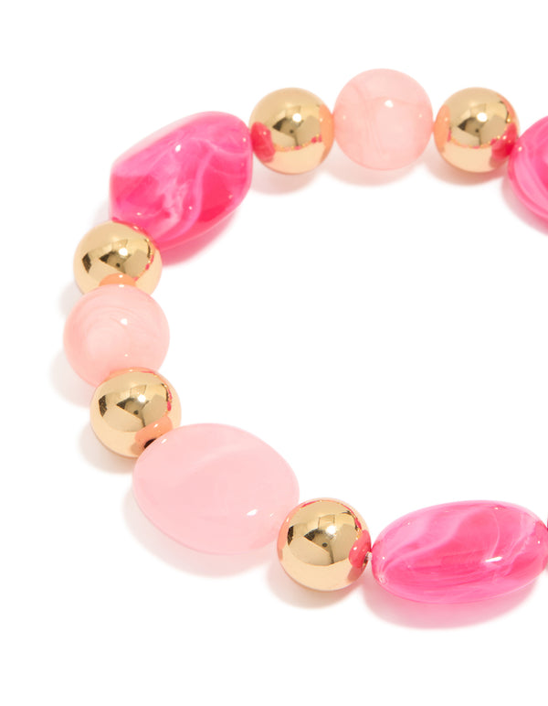Featuring alternating hot pink and light pink acrylic beads with gold accents in a 2-pack stretch bracelet close up view
