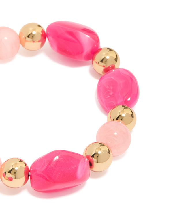 Featuring alternating hot pink and light pink acrylic beads with gold accents in a 2-pack stretch bracelet close up view