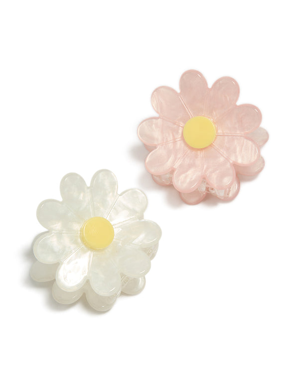 Crafted from acrylic in misty rose, ivory, and lemon chiffon, this white and pink daisy claw clips 2-pack front view