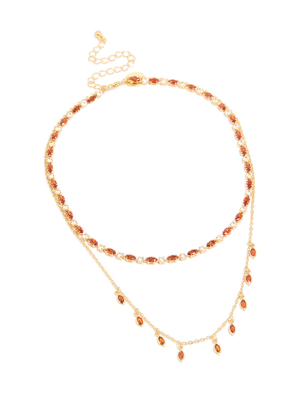 Beautifully designed gold plated red cubic zirconia tennis and teardrop charm layer necklace with statement styling front view