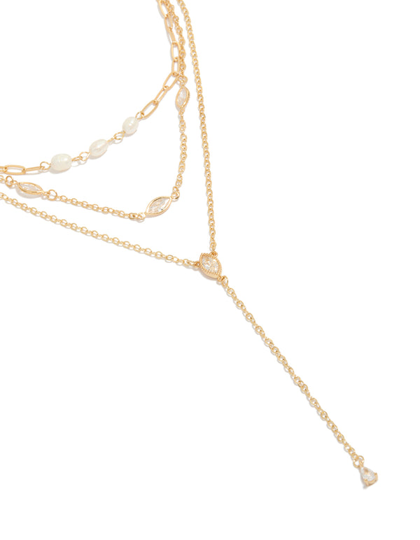 Showcasing a gold plated cubic zirconia and freshwater pearl triple layered Y-necklace in dainty style close up view