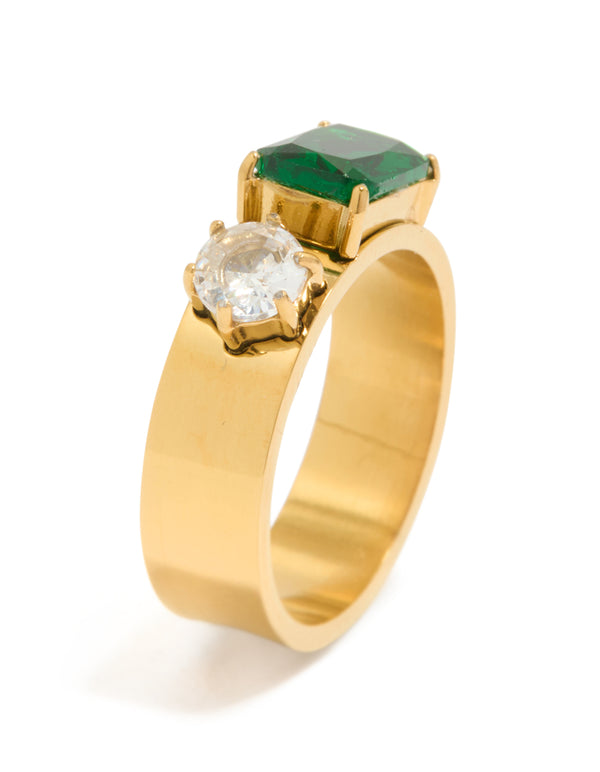 Displaying a waterproof gold plated stainless steel thick band ring with clear and green cubic zirconia in a statement design side detail view