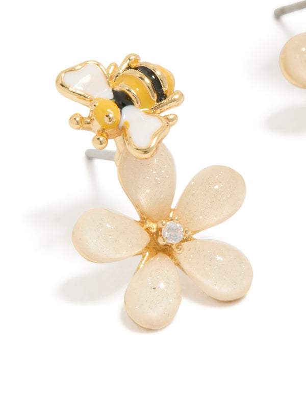 Explore the cutesy pink flower and enamel bee stud earrings in gold plated dainty style with floral feature close up view